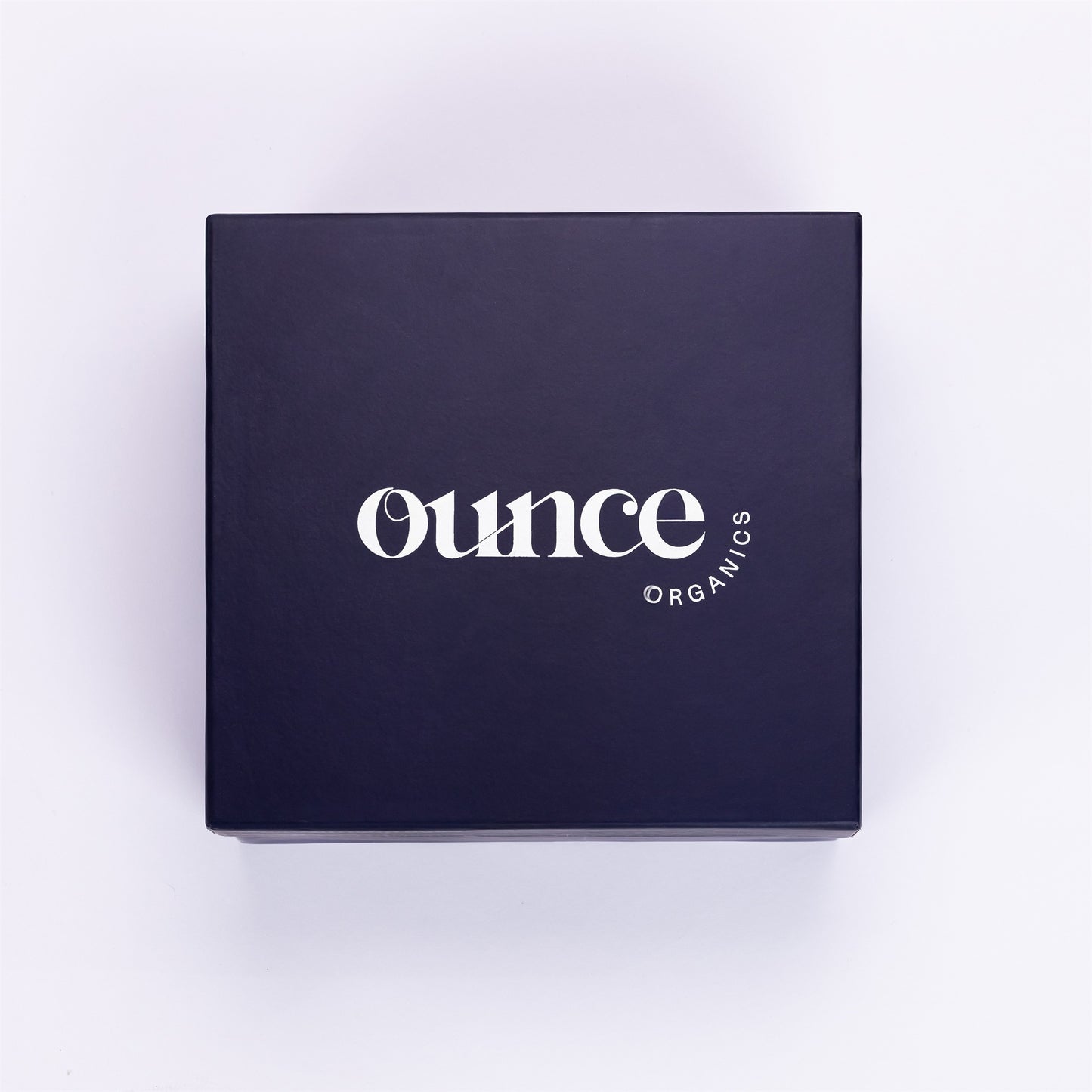 Black box with 'Ounce Organics' logo on a white background